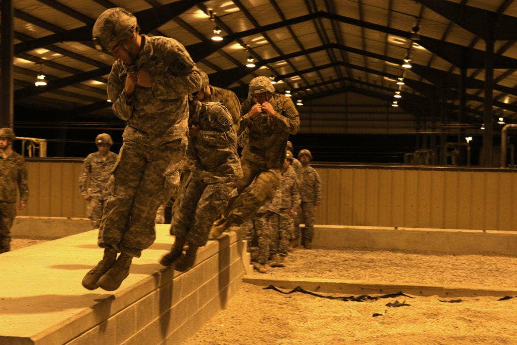 While the rest of the country was watching Super Bowl 50, hundreds of Airborne Artillerymen assigned to the 82nd Airborne Division Artillery rushed down to Green Ramp to conduct sustained airborne training in preparation for a zero-dark-thirty airborne operation the following morning of Feb. 8, 2016., on Fort Bragg, N.C. (Capt. Joe Bush, 82nd Airborne Division Artillery/ Released.)
