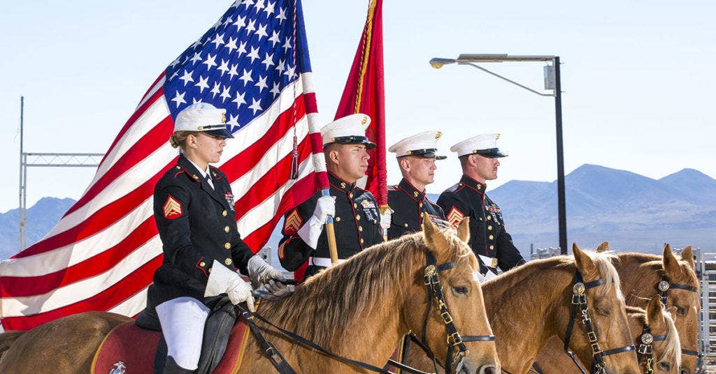 The Marine Corps' Mounted Color Guard. Left to right: Sgt. Monica Hilpisch, Sgt. Moses Machuca, Sgt. Terry Barker and Sgt. Jacob Cummins. (U.S. Marine Corps photo by: Carlos Guerra)