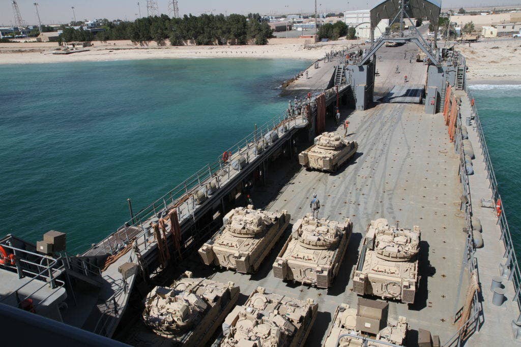 Bradley Fighting Vehicles from Company A, 1st Battalion, 22nd Infantry, 1st Brigade Combat Team, 4th Infantry Division, get loaded on 805th Transportation Detachment, Logistics Support Vessel 8, U.S. Army Vessel, Maj Gen. Robert Smalls at Kuwait Naval Base, Kuwait, March 25, 2013. (U.S. Army photo by Sgt. William E. Henry, 38th Sustainment Brigade)
