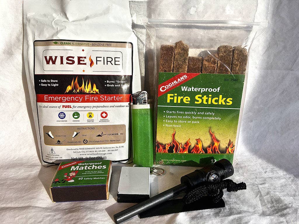 Redundancy is key here. It's easy to carry several forms of fire making materials without overloading the pack. Wise Fire Starter, fire sticks, butane lighters, and flint are all fairly lightweight.