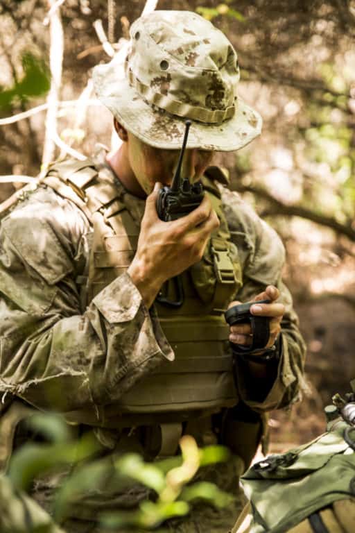 A Marine in the Scout Sniper Platoon with 2nd Battalion, 2nd Marine Regiment calls in coordinates for a position report during a patrol for SSP training aboard Camp Lejeune, N.C., July 29, 2015.(U.S. Marine Corps photo by Cpl. Krista James/Released)