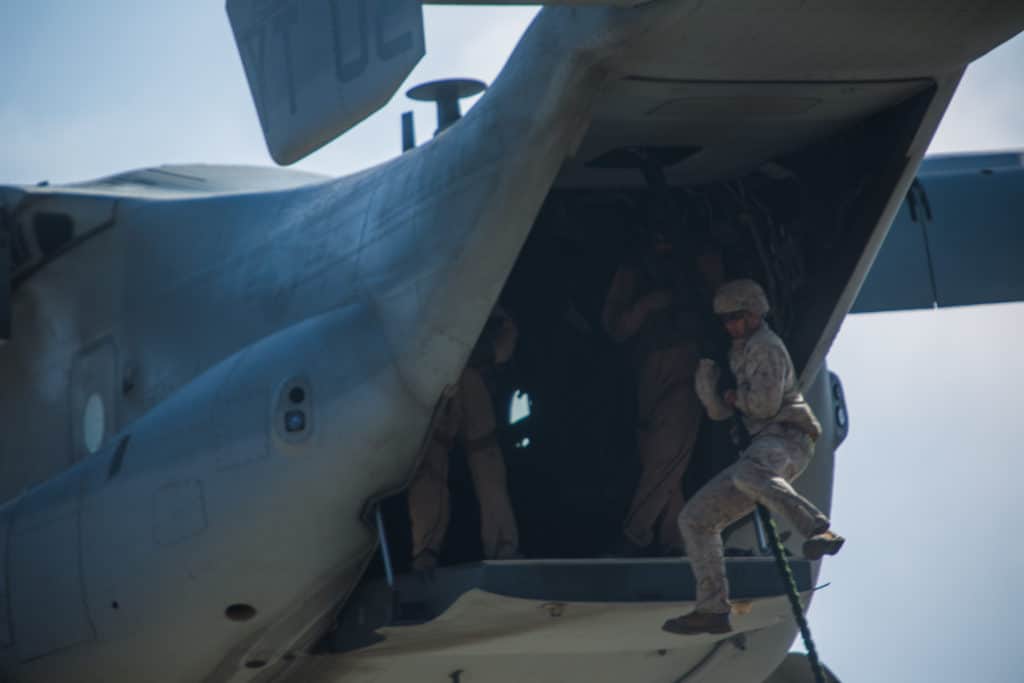 Marines with 2nd Battalion, 5th Marine Regiment, Weapons Company, Scout Sniper Platoon, fast rope from an MV-22B Osprey with Marine Medium Tiltrotor Squadron 164 aboard Marine Corps Base Camp Pendleton, Calif., June 30. (U.S. Marine Corps photo by Sgt. Lillian Stephens/Released)