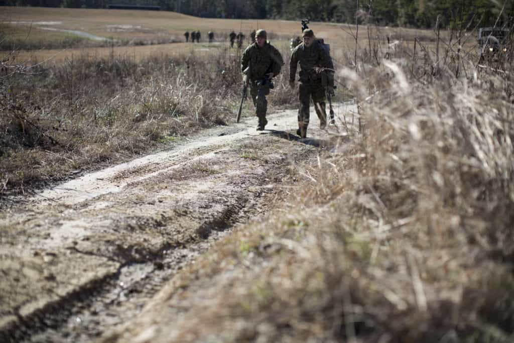 Students with the Marine Scout Sniper School, Advanced Infantry Training Battalion, School of Infantry-East, move to their next firing positions while conducting a known-distance course of fire at Hathcock Range, Stone Bay, Feb. 8, 2016. (U.S. Marine Corps photo by SOI-East Combat Camera, Cpl. Andrew Kuppers/Released)
