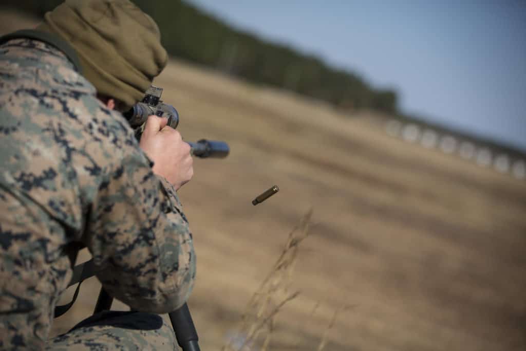 Scout sniper firing his weapon