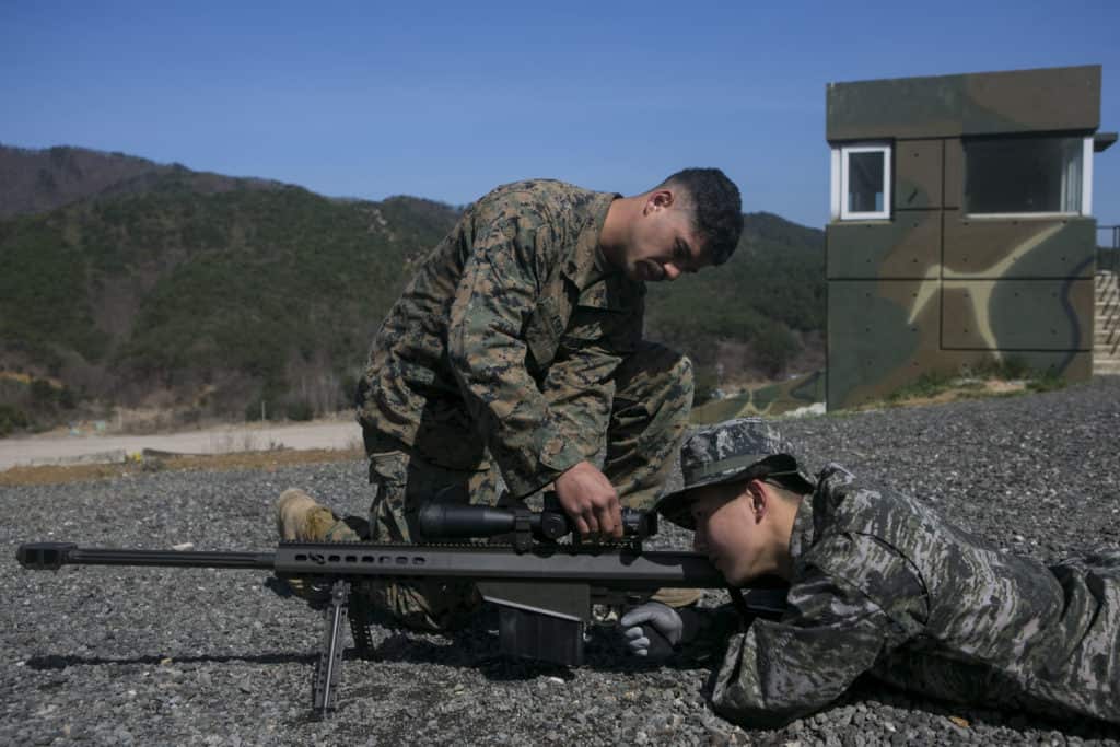 Scout snipers aiming a gun