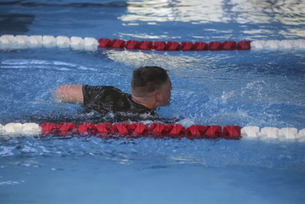 A Marine candidate with the Scout Sniper Screening Platoon, 2nd Battalion, 8th Marine Regiment, conducts a 500-meter swim as part of the Scout Sniper Physical Assessment Test at Camp Lejeune, N.C., Oct. 19, 2015. The 500-meter swim was the first of several physically demanding events that tested endurance, strength and speed. (U.S. Marine Corps photo by Cpl. Paul S. Martinez)