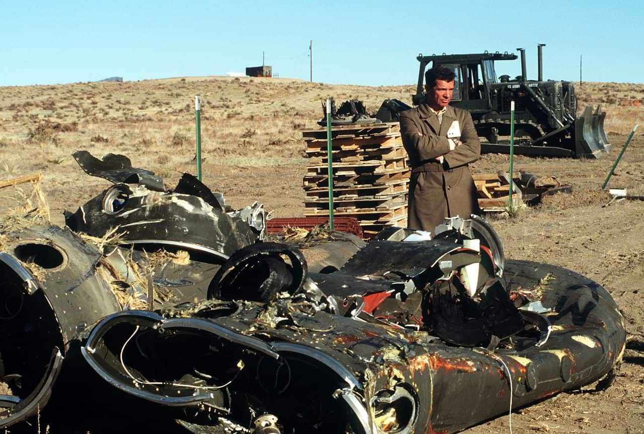 A Soviet inspector stands beside the mangled remnants of two Pershing II missile stages. Several missiles are being destroyed in the presence of Soviet inspectors in accordance with the Intermediate-Range Nuclear Forces (INF) Treaty. (DOD photo)