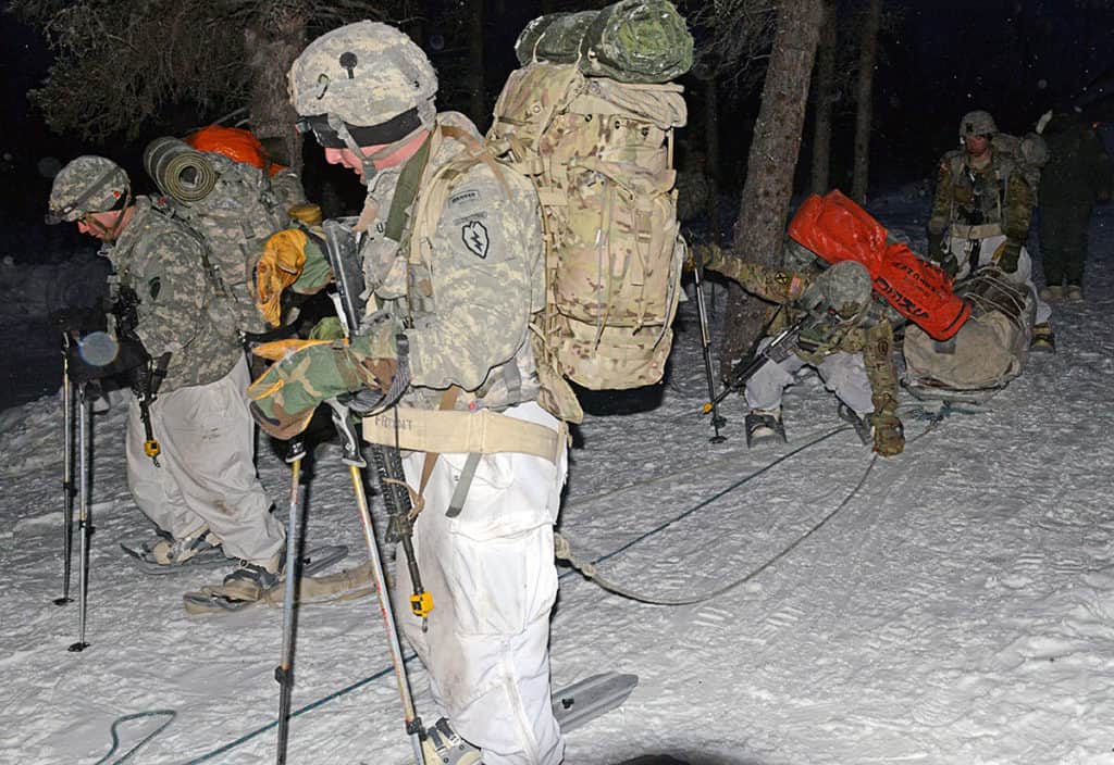 Students pull the ahkio during a night movement during the bivouac portion of the Cold Weather Leaders Course, Feb. 9-14, 2017. The CWLC is taught at the Northern Warfare Training Center at Black Rapids, Alaska. The entire course ran Feb. 2-16, 2017. (Photo Credit: David Vergun)