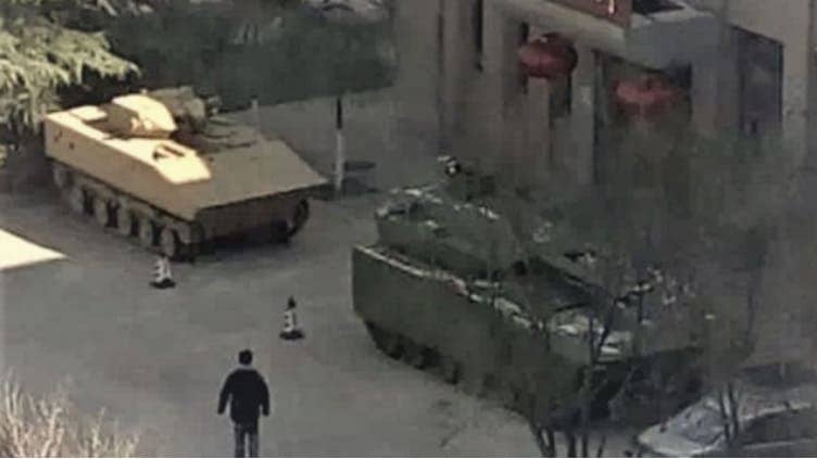 A ew Chinese infantry fighting vehicle (right) is seen in this photo circulating around discussion forums. (Photo from CJDBY via Janes.com)
