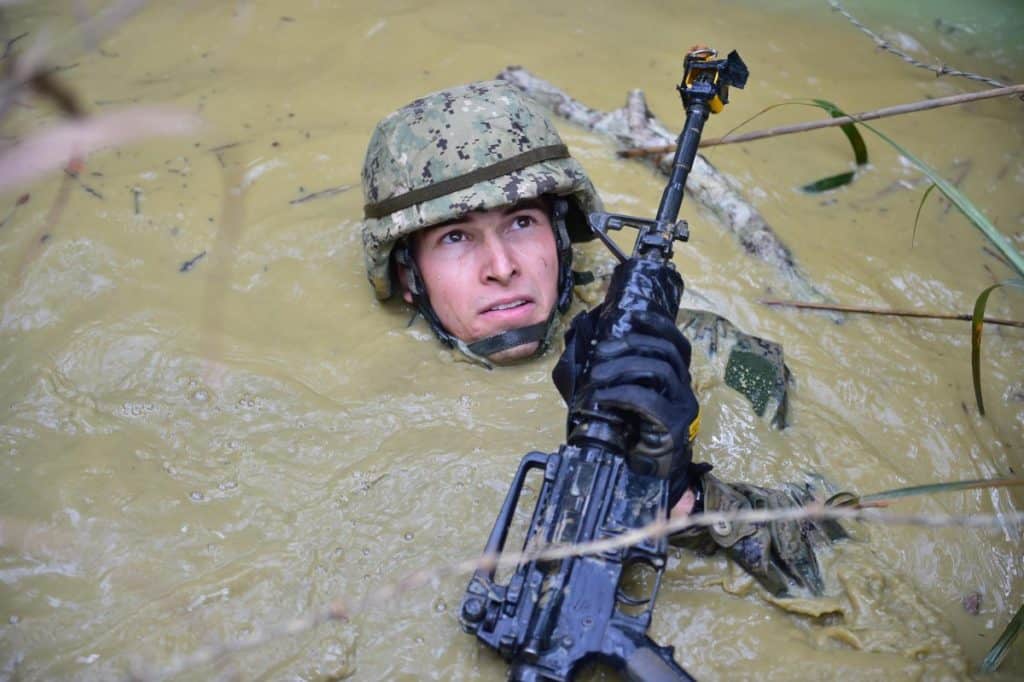 Seabee participating in the endurance course at the Jungle Warfare Training Center in Okinawa, Japan. | US Navy photo by Mass Communication Specialist 2nd Class Adam Henderson