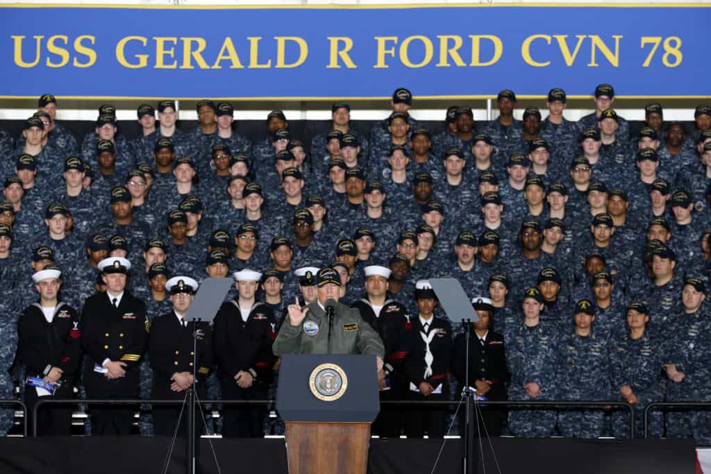 President Donald J. Trump speaks with Sailors in the hangar bay aboard Pre-Commissioning Unit Gerald R. Ford (CVN 78). Trump visited March 2 to meet with Sailors and shipbuilders of the Navy's first-in-class aircraft carrier during an all-hands call inside the ship's hangar bay. (U.S. Navy photo by Mass Communication 1st Class Joshua Sheppard/Released)