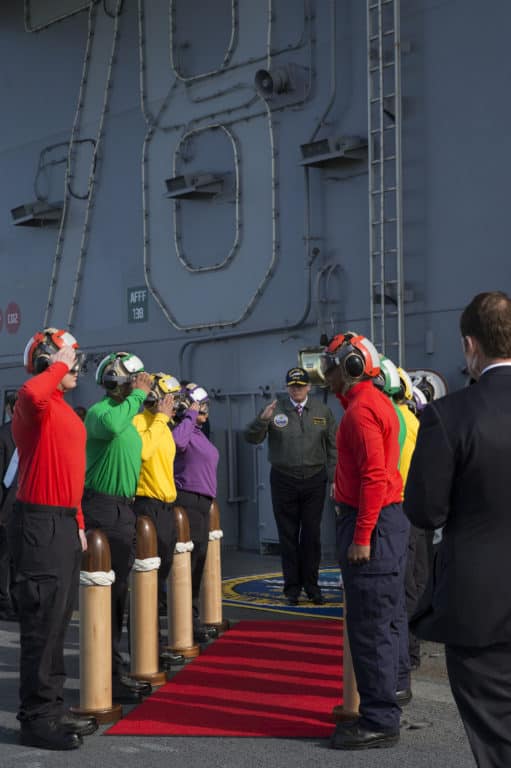 President Donald J. Trump salutes the rainbow sideboys before his departure of the aircraft carrier Pre-Commissioning Unit Gerald R. Ford (CVN 78). (U.S. Navy photo by Mass Communication Specialist 3rd Class Cathrine Mae O. Campbell/Released)