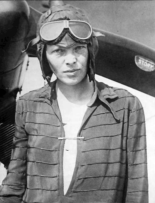 Photo of Amelia Earhart in flight cap and goggles as she awaits word as to whether she would be among those who were flying across the Atlantic in 1928.