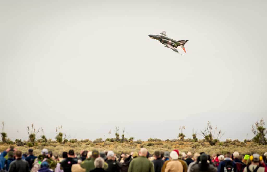 A McDonnell Douglas QF-4 Phantom II of the 82nd Aerial Target Squadron Detachment 1 steaks over the crowd gathered to witness the final military flight of the storied aircraft at Holloman AFB, N.M., Dec. 21, 2016. The F-4 Phantom II entered the U.S. Air Force inventory in 1963 and was the primary multi-role aircraft in the USAF throughout the 1960s and 1970s. The F-4 flew bombing, combat air patrol, fighter escort, reconnaissance and the famous Wild Weasel anti-aircraft missile suppression missions. The final variant of the Phantom II was the QF-4 unmanned aerial targets flown by the 82nd at Holloman AFB. (U.S. Air Force photo by J.M. Eddins Jr.)