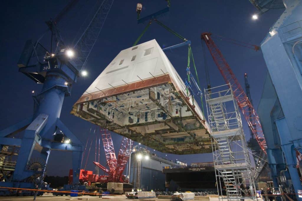 The 1,000-ton deckhouse of the future destroyer USS Zumwalt (DDG 1000) is craned toward the deck of the ship to be integrated with the ship's hull at General Dynamics Bath Iron Works. The ship launch and christening are planned in 2013. (U.S. Navy photo/Released)