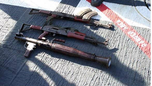 Confiscated weapons lay on the deck of guided missile cruiser USS Cape St. George (CG 71) following an early-morning engagement with suspected pirates. (U.S. Navy photo.)