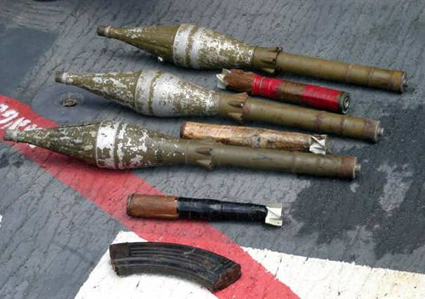 Rocket propelled grenades (RPGs) and other armaments lay on the deck of USS Cape St. George (CG 71) after being confiscated during an early-morning engagement with suspected pirates. (U.S. Navy photo.)
