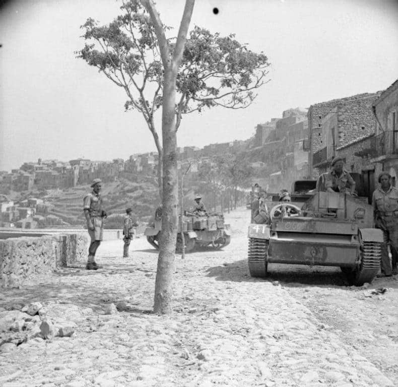 Universal carriers and Irish soldiers of the 6th Inniskillings, 38th Irish Brigade, 78th Division in Sicily in August 1943. (Photo: Lt. Gabe, Imperial War Museum)