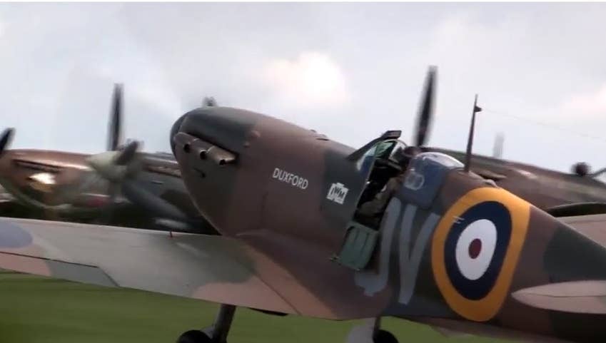 The restored Spitfire Mk. 1A taxis to the runway at an air show in England. (Photo: YouTube/Imperial War Museums)
