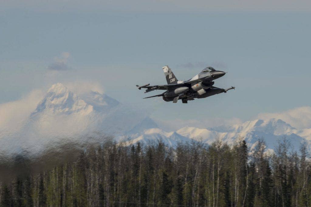 A U.S. Air Force F-16 Fighting Falcon assigned to the 18th Aggressor Squadron at Eielson Air Force Base, Alaska, May 4, 2016, takes off. The five squadrons of F-16s based in South Korea and Japan are capable of delivering the B61 tactical nuclear bomb. (U.S. Air Force photo by Staff Sgt. Joshua Turner)