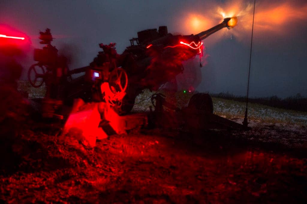 When your artillery spotter is wearing night optics, there's really no reason to stop firing when the sun goes down. (Photo: U.S. Marine Corps Lance Cpl. Juan Bustos)