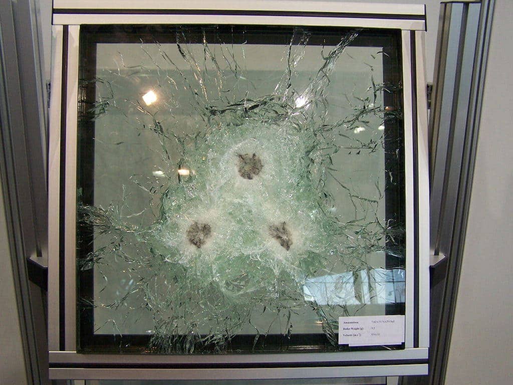 Current bullet-resistant glass after ballistic tests during the IDET 2007 fair in Brno. The good news is the bullets were stopped. The bad news: You can't see through the window. (Photo from Wikimedia Commons)