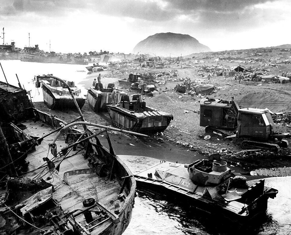 Amtracs severely damaged on the shores of Iwo Jima. (Robert M. Warren, United States Navy)