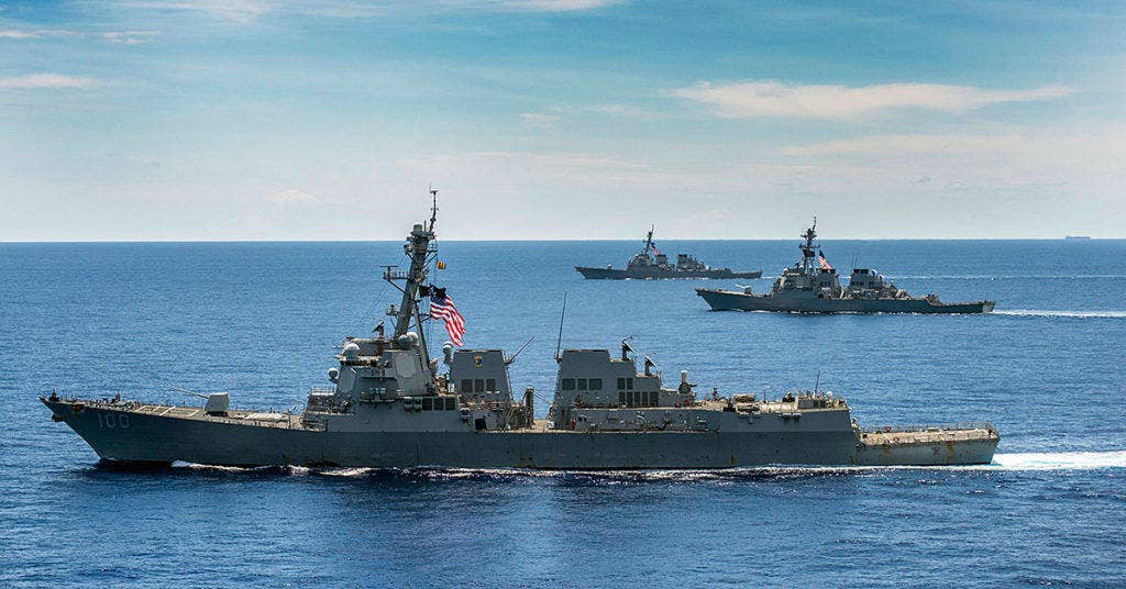 USS John McCain confronts Chinese ships in South China Sea.