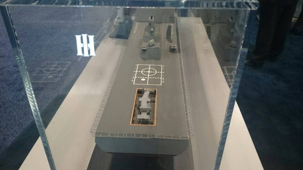 A look at the sern of a model of a proposed ballistic missile defense ship displayed at SeaAirSpace2017 by Huntington Ingalls Industries. The well deck from the San Antonio is converted into a hangar - reminiscent of late World War II surface combatants. (Photo by Harold Hutchison)
