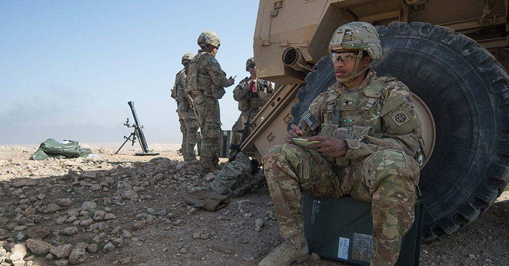 Spc. Alan Yearby, assigned to 2nd Battalion, 325th Airborne Infantry Regiment, 2nd Brigade Combat Team, 82nd Airborne Division, makes sketches of the terrain while manning a mortar fire position near Mosul, Iraq, Feb. 28, 2017. A global Coalition of more than 60 regional and international nations have joined together to enable partner forces to defeat ISIS. CJTF-OIR is the global Coalition to defeat ISIS in Iraq and Syria. (U.S. Army photo by Staff Sgt. Alex Manne)