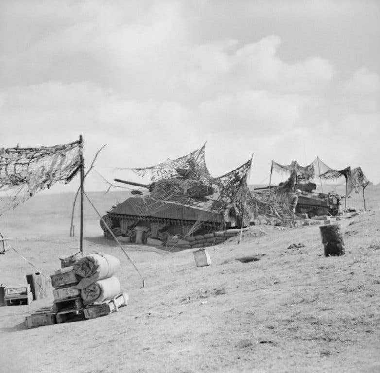 Sherman tanks of the British Army fire from prepared positions on the Anzio beachhead. The 36th Engineer Regiment was specially trained in amphibious assaults like the Anzio landings. (Photo: British Army Sgt. Radford)