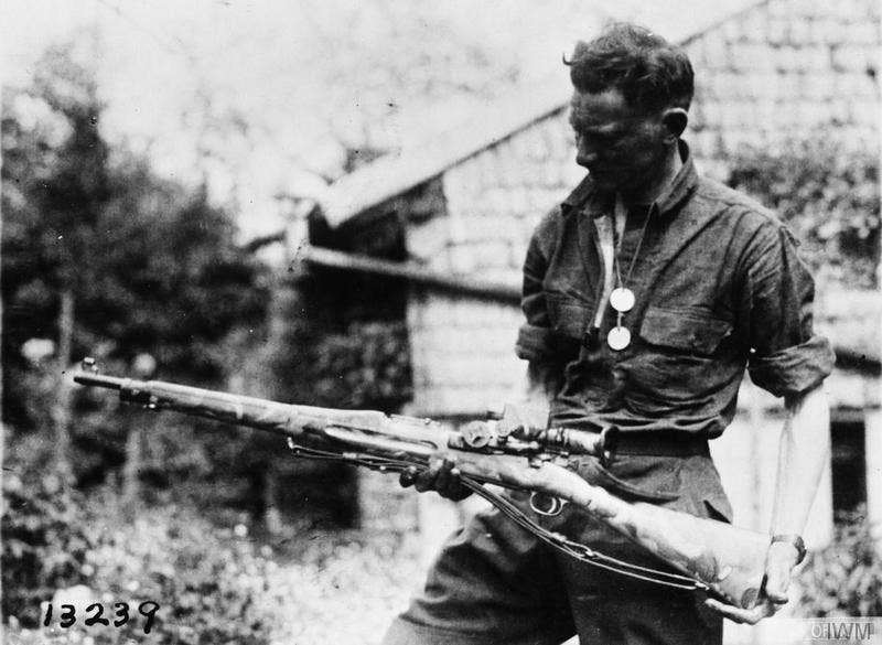 A U.S. soldier holds a camouflaged Springfield 1903 sniper rifle during World War I. (Photo: U.S. Army via Imperial War Museum)