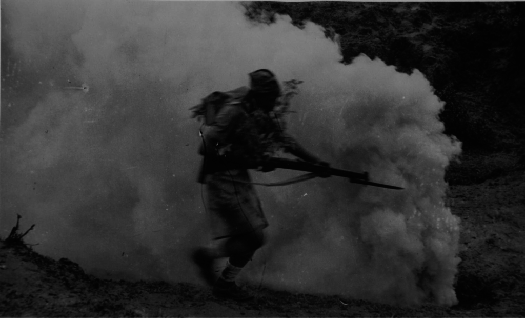 An unknown Gurkha soldier charges an enemy position in WWII Burma.