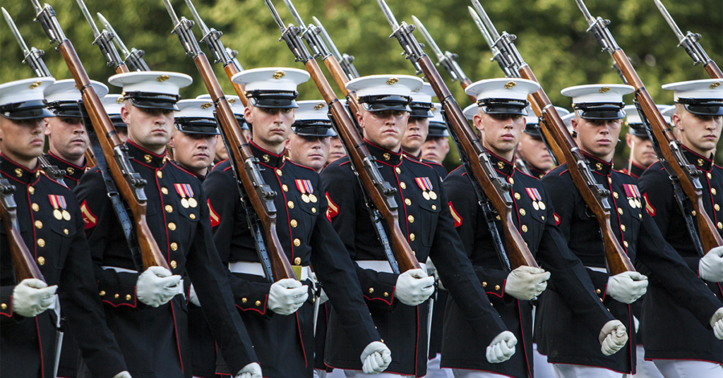 The Marine Corps Silent Drill Platoon executes their refined movements with hand-polished, 10.5 pounds, M1 Garand rifles with fixed bayonets during the Sunset Parade at the Marine Corps War Memorial in Arlington, Va. (U.S. Marine Corps photo)