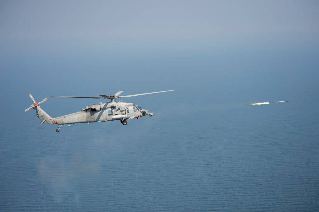 A MH-60 Seahawk fires an Advanced Precision Kill Weapon System rocket. (US Navy photo).