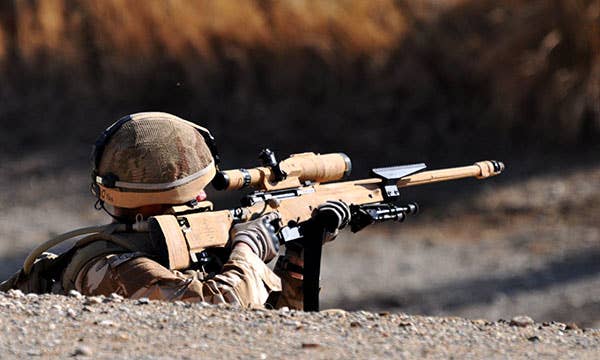 A British sniper sights down his L115A3 sniper rifle. (Photo: Ministry of Defense)