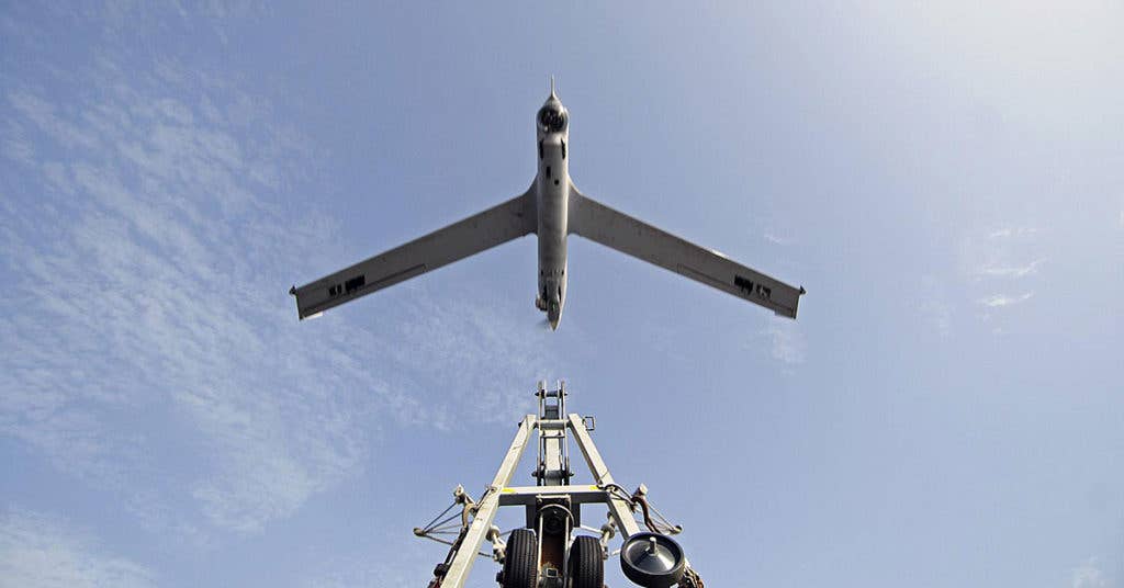 Drones are changing modern warfare. See here, a Scan Eagle unmanned aerial vehicle launches from the amphibious dock landing ship USS Comstock. (U.S. Dept. of Defense photo)