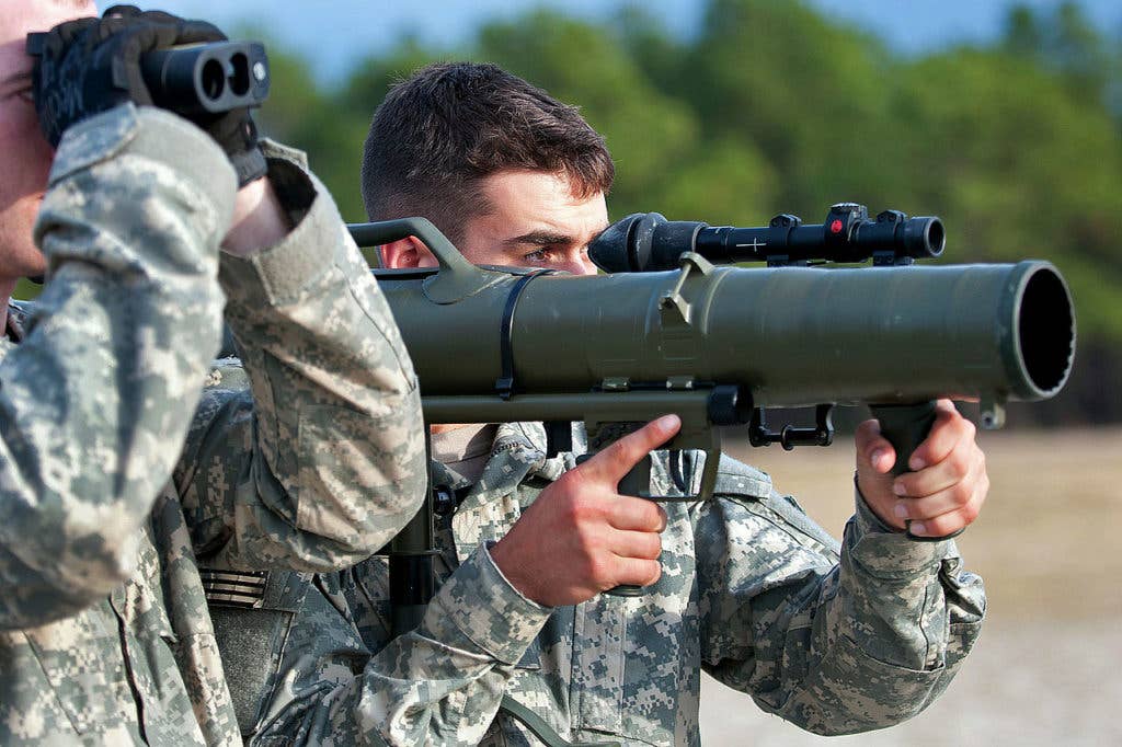 A paratrooper shoulders a Carl Gustav M3 84mm recoilless rifle while his partner optically measures the distance to a target during a certification course on Fort Bragg, N.C. (US Army photo)