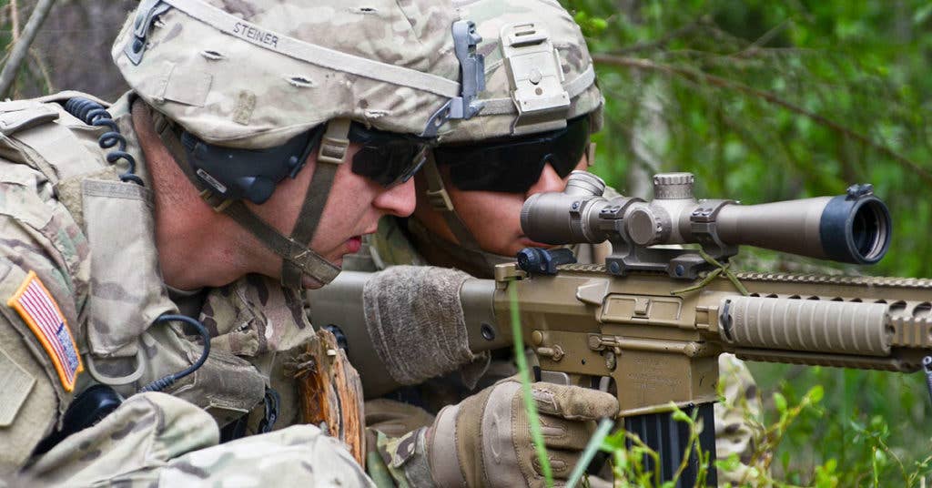 Spc. Artemio Veneracion (back), an infantryman with Eagle Troop, 2nd Squadron, 2nd Cavalry Regiment, informs his team leader, Sgt. Ryan Steiner, that he has acquired his target with his M110 Semi-automatic Sniper System (SASS) during a Squad Training Exercise (STX) at Tapa Training Area in Estonia, May 26, 2016. (U.S. Army photo by Staff Sgt. Steven M. Colvin)