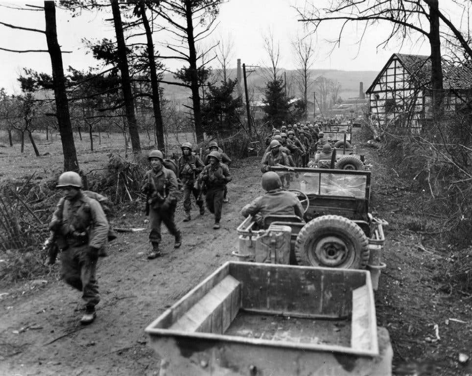 Soldiers with the 1st Infantry Division move up in Germany during World War II. (Photo: U.S. Army Technician 3rd Class Jack Kitzerow)