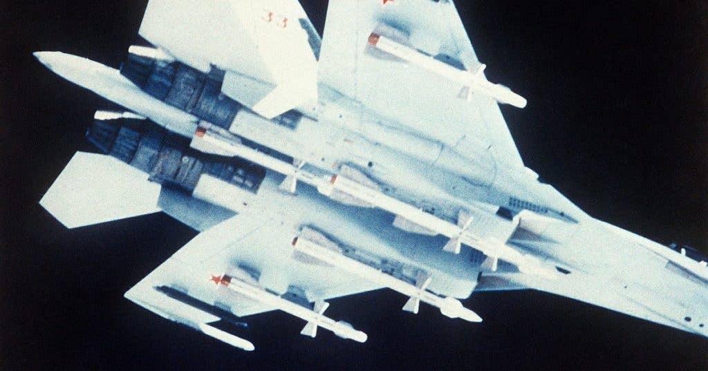 An underside view of a Soviet Su-27 Flanker aircraft carrying air-to-air missiles. (DOD photo)