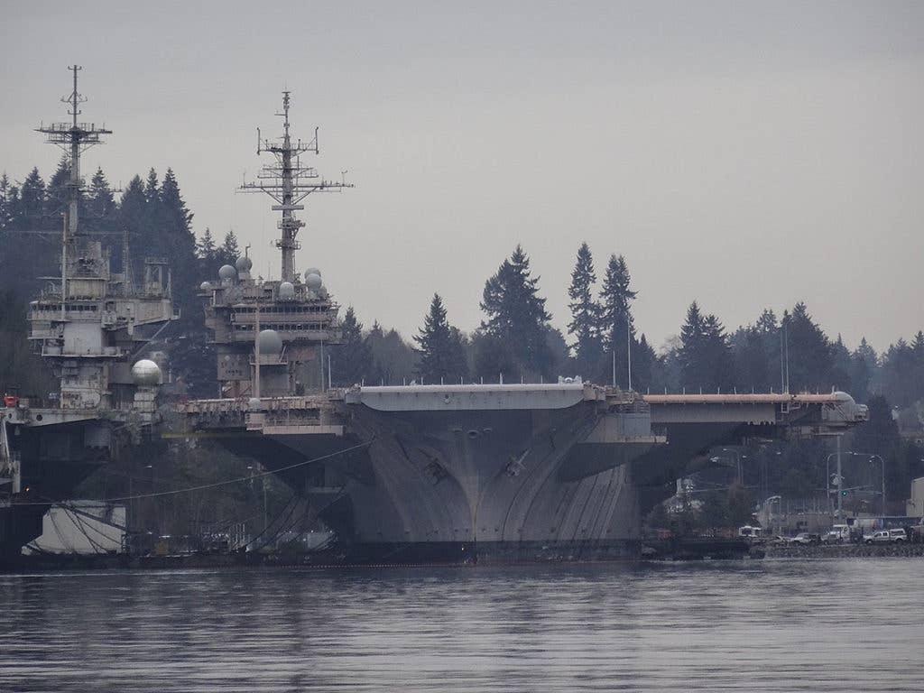 The inactive USS Kitty Hawk berthed near Bremerton, WA (Wikimedia Commons)