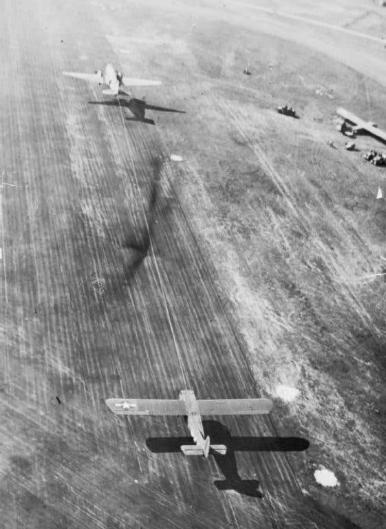 A C-47 takes off, towing a Waco CG-4 glider during Operation Market Garden. (Imperial War Museum photo)