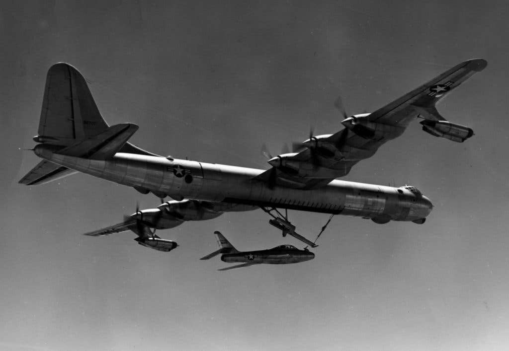 A B-36 Peacemaker launching an F-84 parasite fighter as part of a FICON test (USAF)