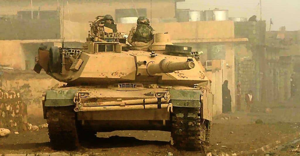 Soldiers from 3rd Armored Cavalry Regiment conduct security with their M1 Abrams Main Battle Tank for a cordon and search operation in Biaj, Iraq. (Photo: U.S. Air Force Staff Sgt. Aaron Allmon II)