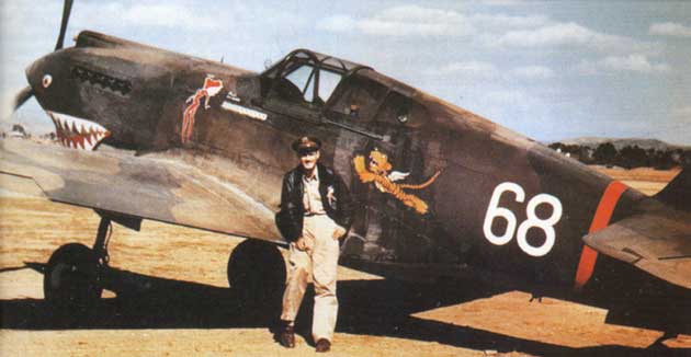 A Flying Tiger in front of Charles Older's P-40. Older had 10 kills with the Flying Tigers, and added eight more later. (AVG photo via Wikimedia Commons)