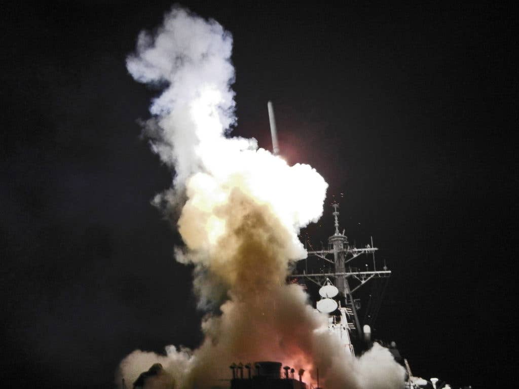 The Arleigh Burke-class guided-missile destroyer, USS Barry (DDG 52), launches a Tomahawk missile in support of Operation Odyssey Dawn.