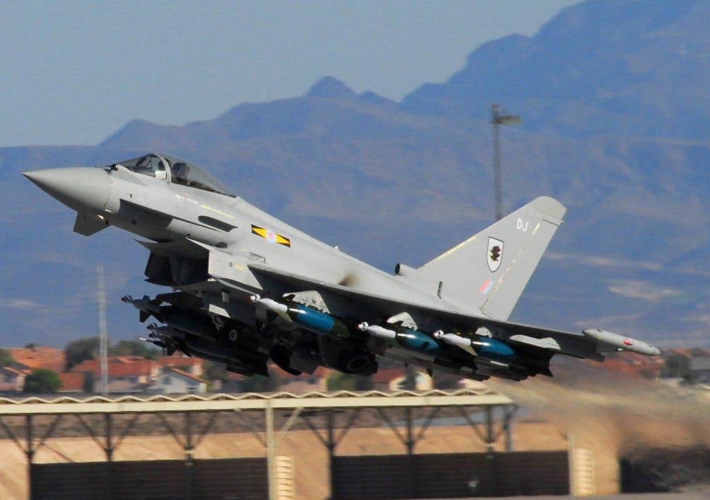 A bomb-laden Royal Air Force Typhoon F.2 fighter takes off for an evening mission here June 3 during Green Flag 08-07. During Green Flag, the RAF proved the Typhoons' air-to-ground capabilities and combat readiness. (U.S. Air Force photo by Chief Master Sgt. Gary Emery)
