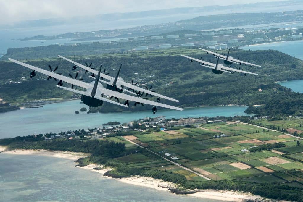 U.S. Air Force MC-130J Commando IIs from the 17th Special Operations Squadron line up in a five-aircraft formation during a mass launch training mission June 22, 2017 off the coast of Okinawa, Japan. Airmen from the 17th SOS conduct training operations often to ensure they are always ready perform a variety of high-priority, low-visibility missions throughout the Indo-Asia-Pacific-Region. (U.S. Air Force photo by Senior Airman John Linzmeier)