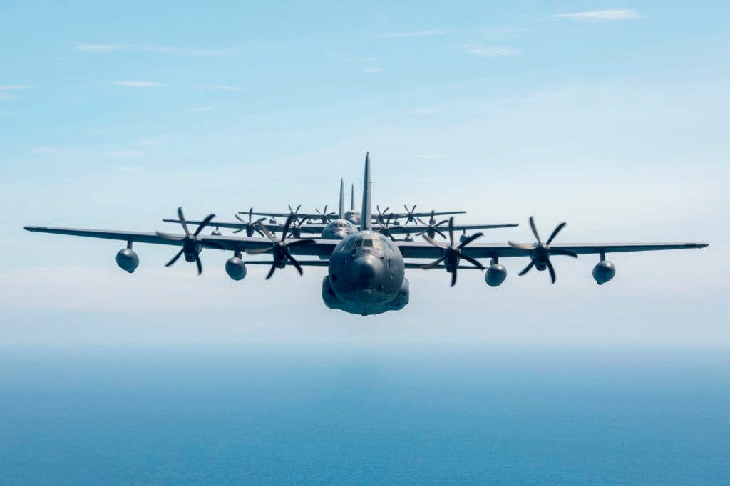 MC-130Js in a line behind another MC-130J during a training exercise. (USAF photo)
